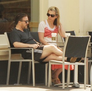 Comedian Ricky Gervais and his partner Jane Fallon relax outside Starbucks drinking coffee