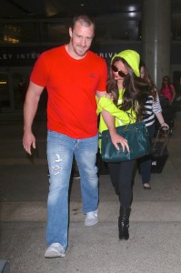 Selena Gomez arrives at LAX Airport on a flight in from Europe accompanied by her bodyguard