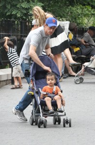 New York mayoral hopeful Anthony Weiner plays with his son at a park near their Manhattan home