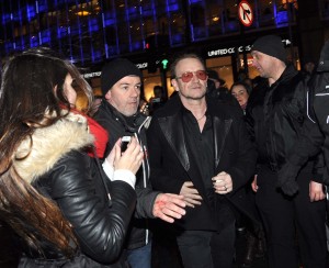 Bono makes his way to the Traditional Annual Christmas Eve Busking Session on Grafton Street