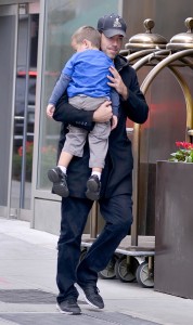 Carson Daly carries his sleeping son Jackson